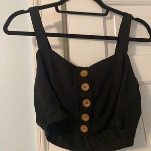 Black crop top, skirt combo with wooden buttons
